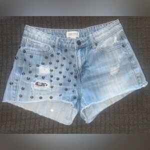 Studded shorts with hand sewn patch